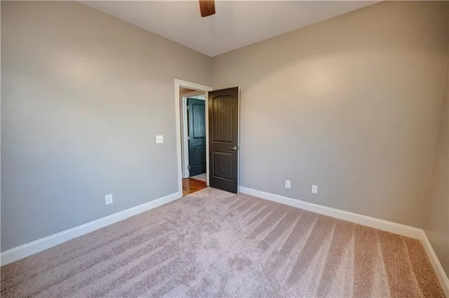 a view of walk in closet with clothes