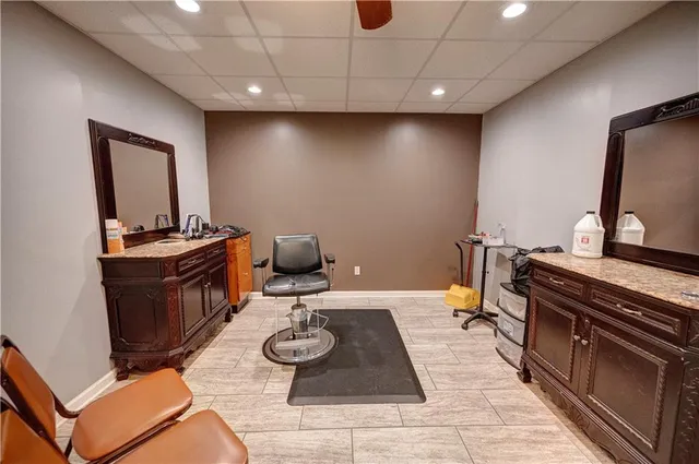 a bathroom with a sink toilet and a mirror