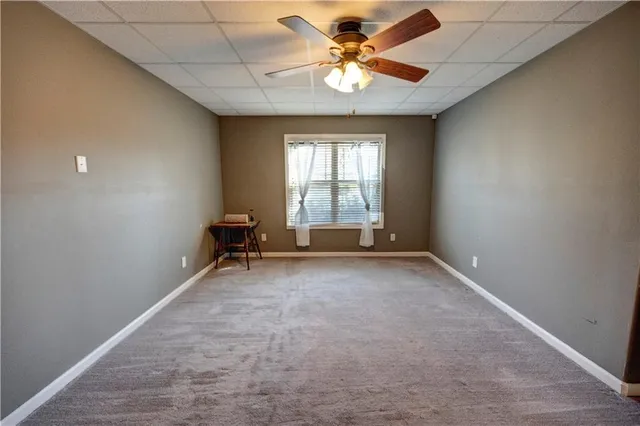 a view of a swimming pool with a chairs