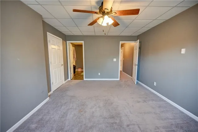 a view of a swimming pool and lounge chairs