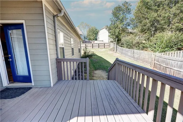 an aerial view of residential house with outdoor space and parking