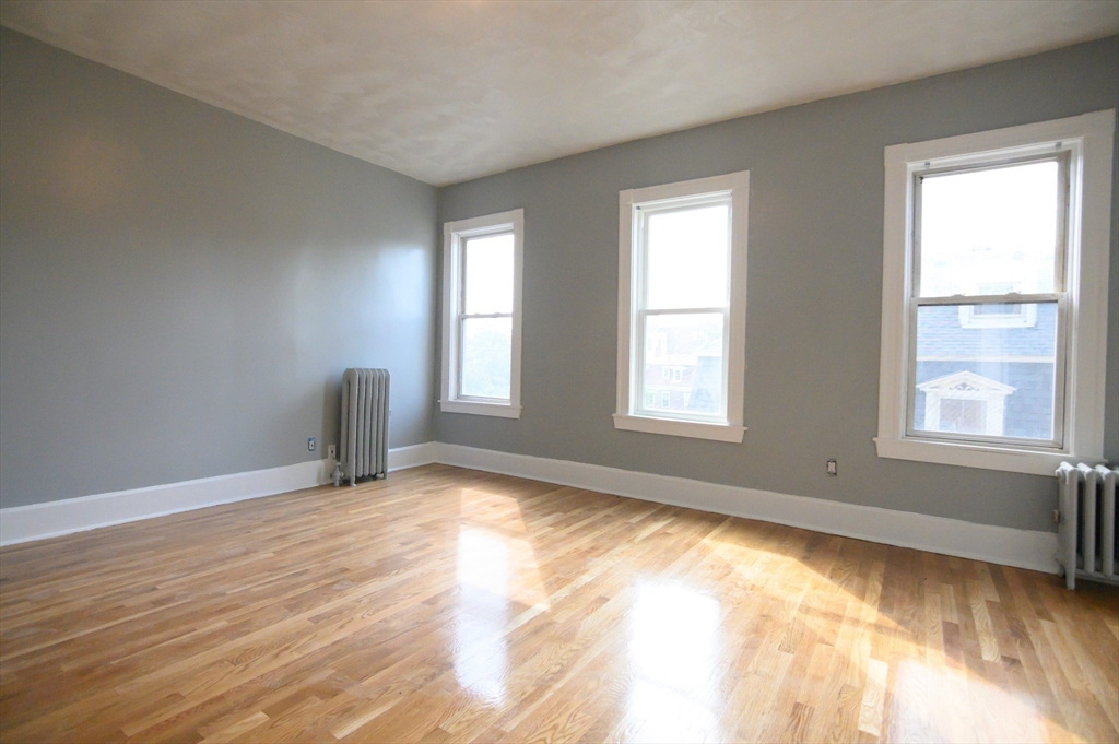 4 Burton Avenue, Unit 3 Boston, MA 02119 - Photo 13 of 17 a view of an empty room with a window