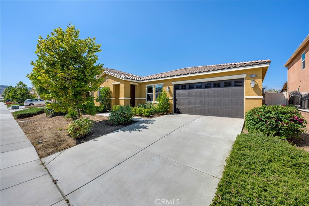 20865 Center Street Riverside, CA 92507 - Photo 1 of 1 a front view of a house with a yard and garage