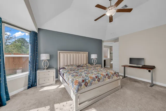 a bedroom with a bed and a table in it