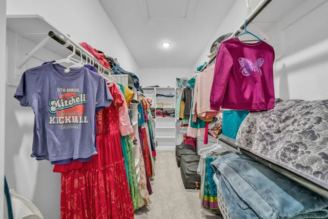 a view of a closet with storage
