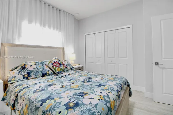 a bedroom with a bed and a table