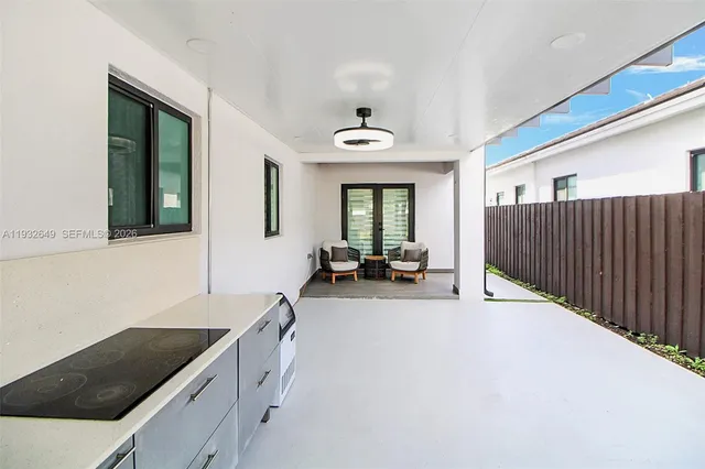 a kitchen with a sink and a stove top oven