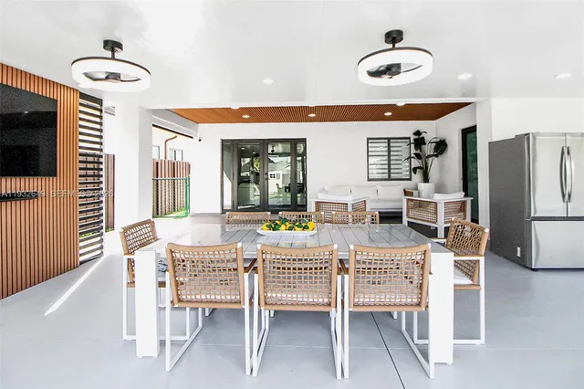 a dining room with furniture and window