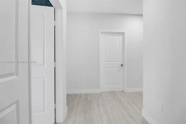 a spacious bathroom with a double vanity sink large mirror and bathtub