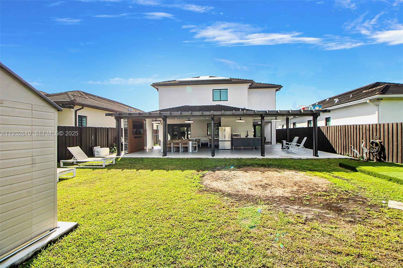 14671 Southwest 20th Street Miami, FL 33175 - Photo 17 of 53 a view of a house with swimming pool and a yard