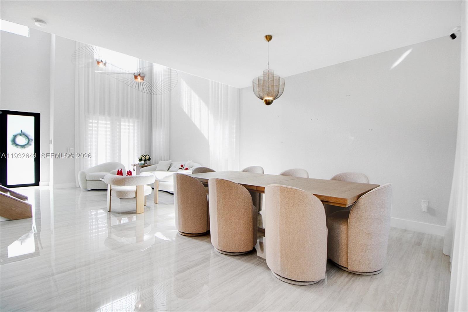 14671 Southwest 20th Street Miami, FL 33175 - Photo 2 of 50 a living room with furniture and a large window