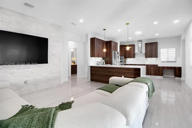 a living room with furniture and a flat screen tv