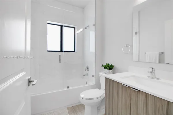 a view of a livingroom with wooden floor