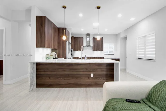 a bathroom with a sink vanity and mirror