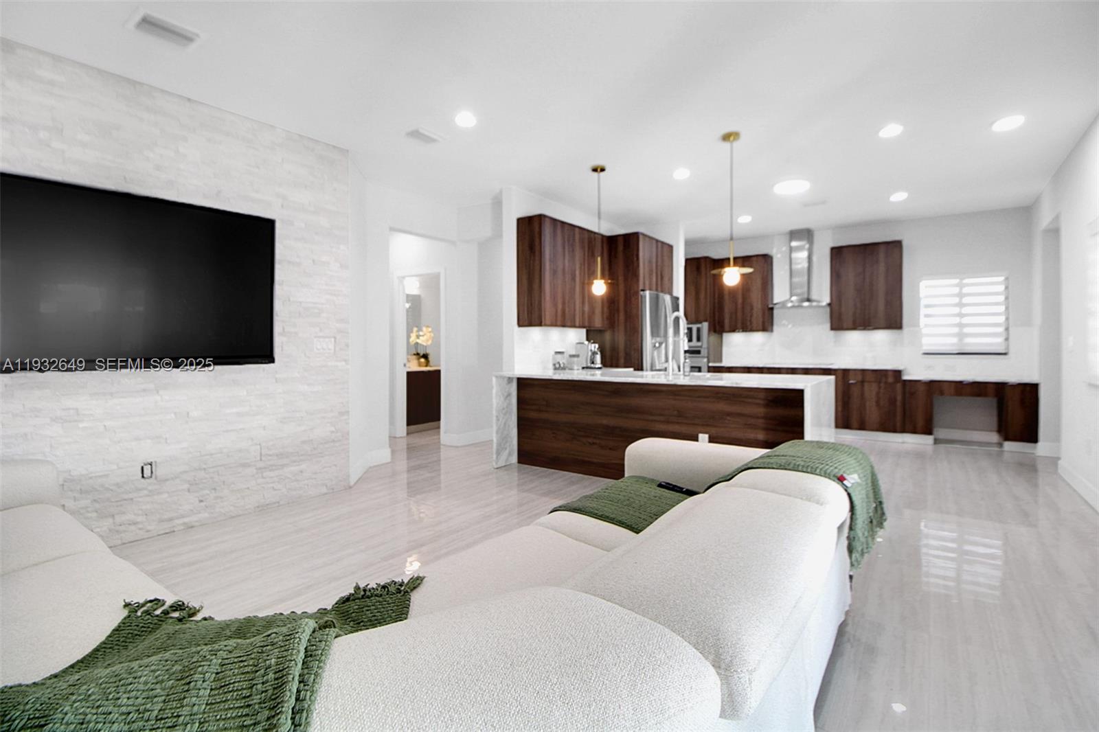 14671 Southwest 20th Street Miami, FL 33175 - Photo 26 of 53 a living room with furniture and a flat screen tv