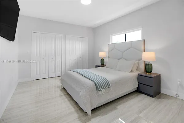 a lobby with furniture and wooden floor