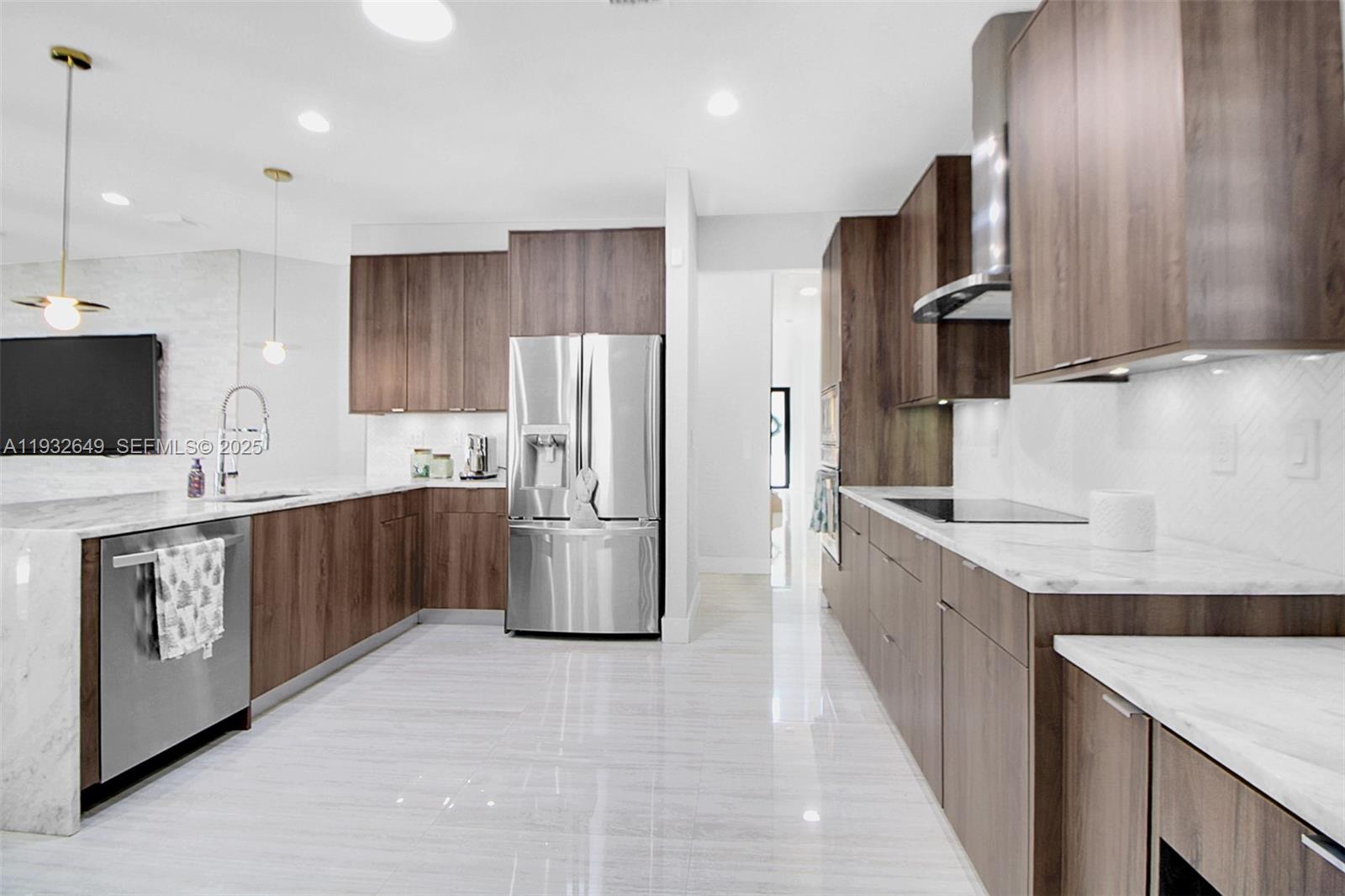 14671 Southwest 20th Street Miami, FL 33175 - Photo 28 of 53 a kitchen with stainless steel appliances a refrigerator sink and stove