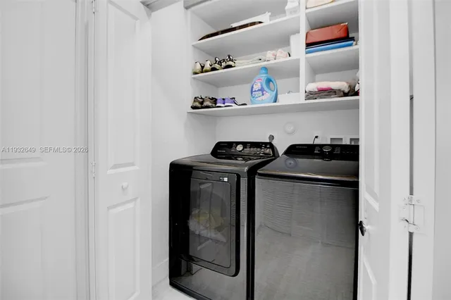 a bedroom with a bed and a television