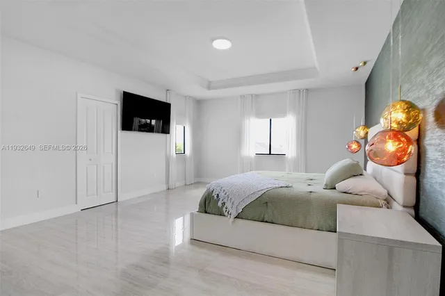 a bedroom with a bed and a table