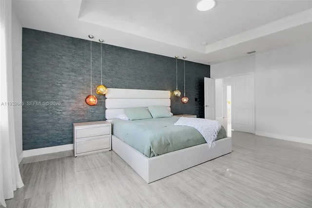 a spacious bathroom with a double vanity sink large mirror and bathtub