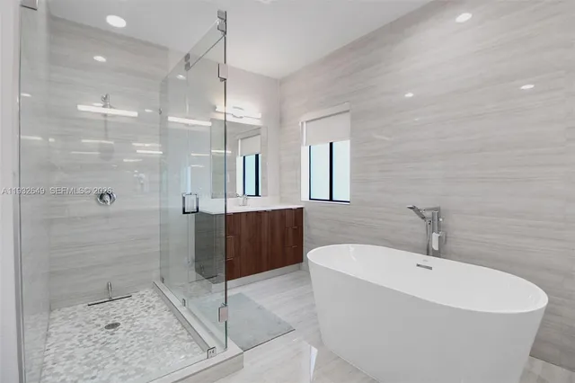 a white toilet sitting next to a white sink