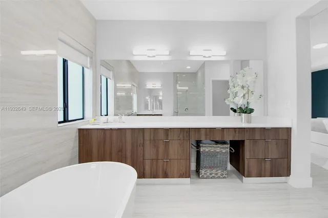 a bathroom with a sink a toilet and a bathtub