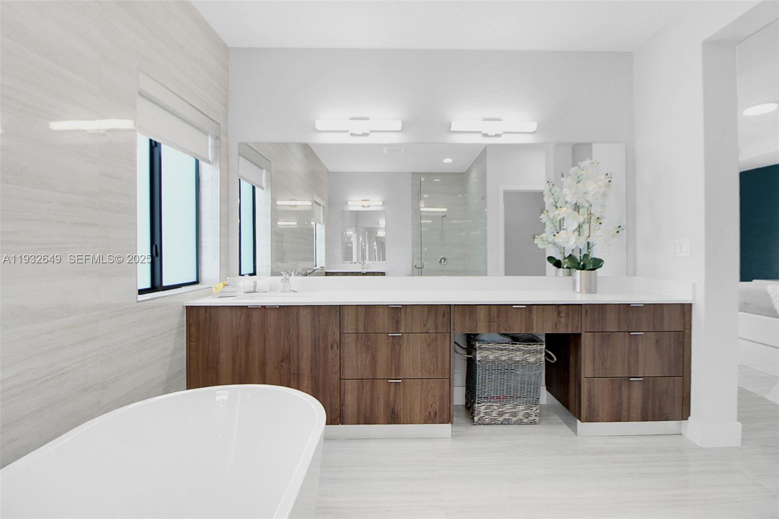 14671 Southwest 20th Street Miami, FL 33175 - Photo 42 of 53 a bathroom with a sink a mirror and a bathtub