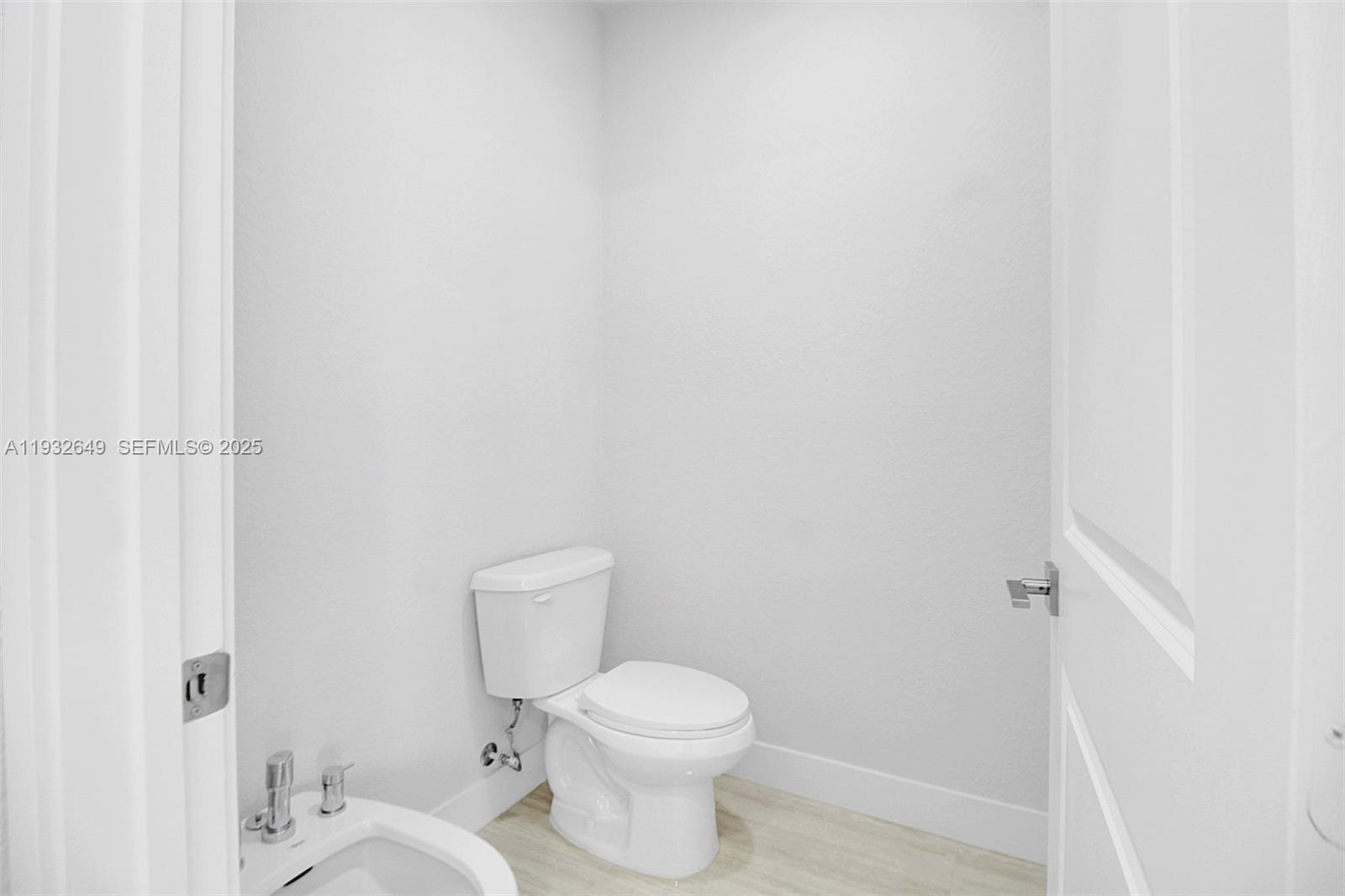 14671 Southwest 20th Street Miami, FL 33175 - Photo 43 of 53 a white toilet sitting next to a white sink