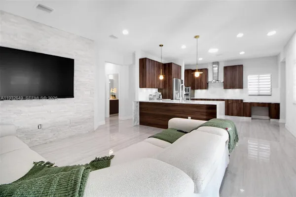 a bathroom with a sink vanity and mirror
