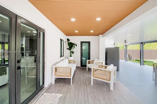 a lobby with furniture and wooden floor