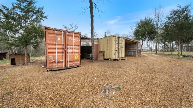 a view of a house with a yard and garage