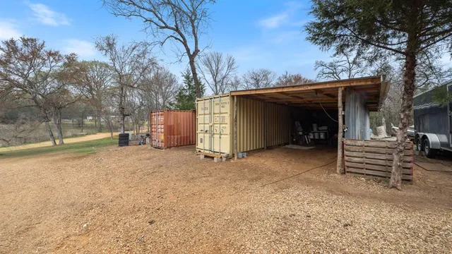 a bed room with a bed and a television