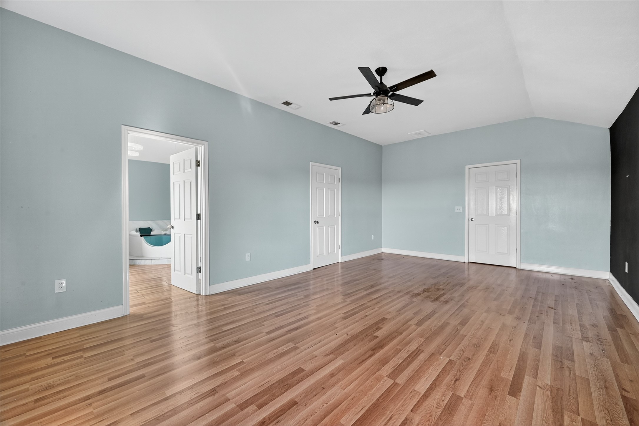 6434 Boothline Road Richmond, TX 77469 - Photo 25 of 36 wooden floor in an empty room with a window