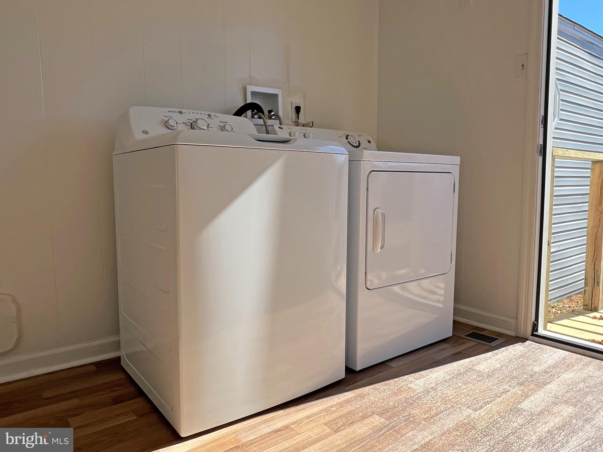 31658 Siham Road, Unit E42 Lewes, DE 19958 - Photo 13 of 35 a utility room with dryer and washer
