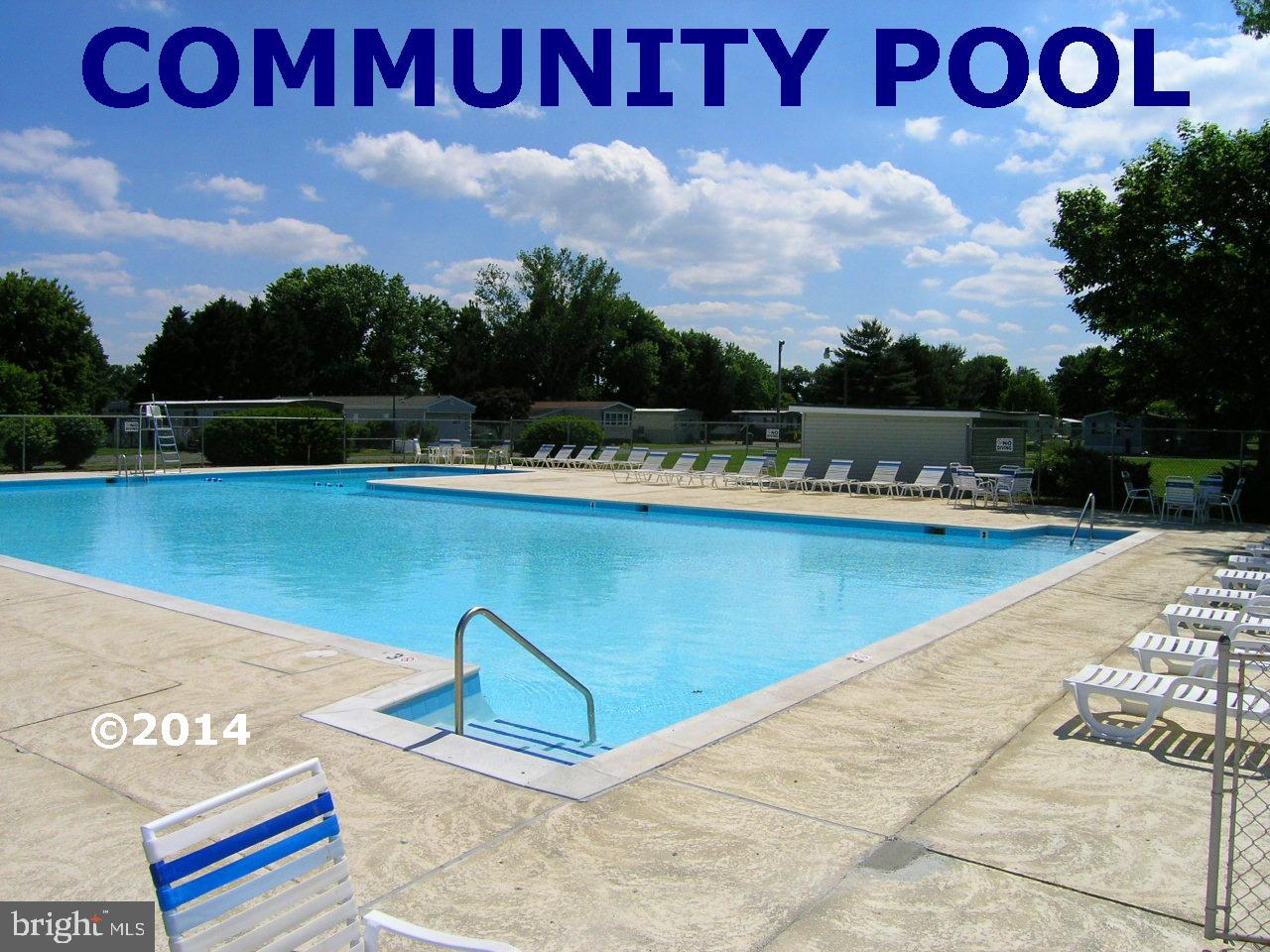 31658 Siham Road, Unit E42 Lewes, DE 19958 - Photo 34 of 35 a view of a swimming pool and lake view