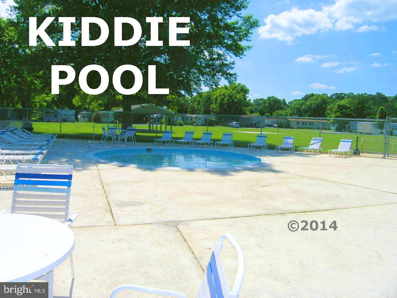 31658 Siham Road, Unit E42 Lewes, DE 19958 - Photo 35 of 35 a view of a street with houses on the road