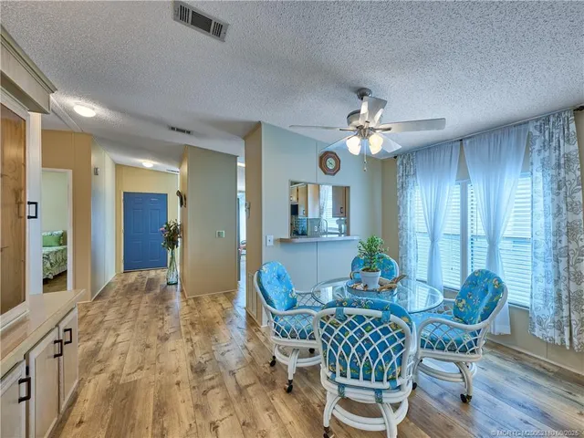 a kitchen with granite countertop a sink stainless steel appliances and cabinets