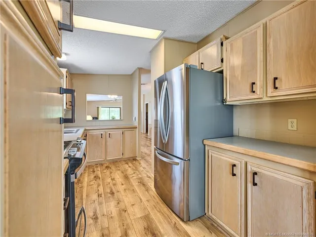 a workspace room with furniture and a window
