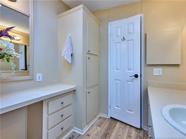 a bedroom with a bed window and a chair