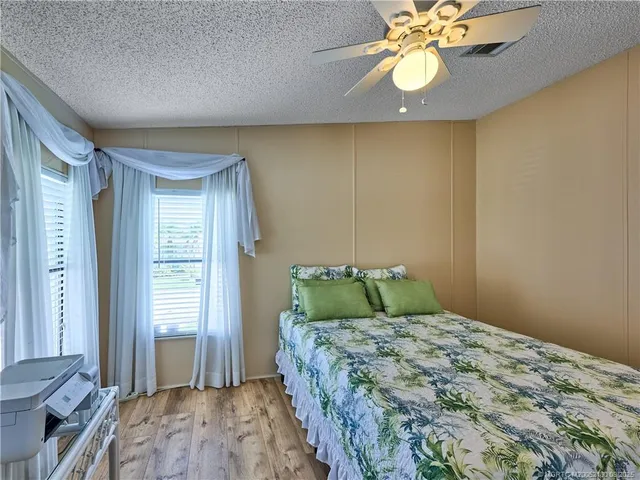 a bathroom with a toilet and a shower curtain