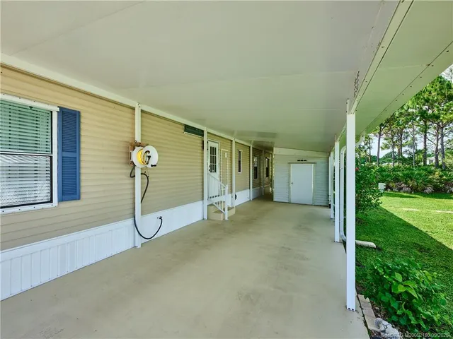 a utility room with dryer washer and a refrigerator