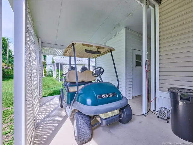 a view of swimming pool with outdoor seating and a patio