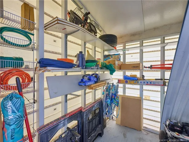 a view of a swimming pool with an outdoor seating
