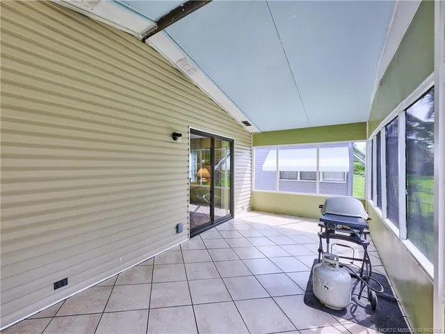 a very nice looking kitchen with a large window