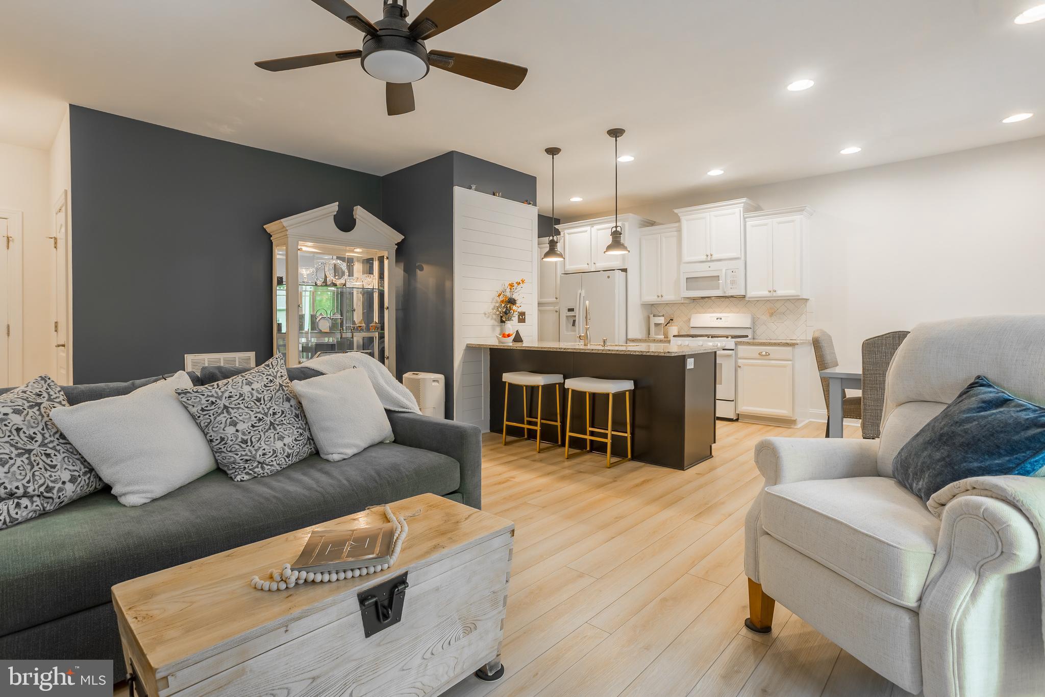 18308 Emerson Way Georgetown, DE 19947 - Photo 12 of 43 a living room with furniture and kitchen view