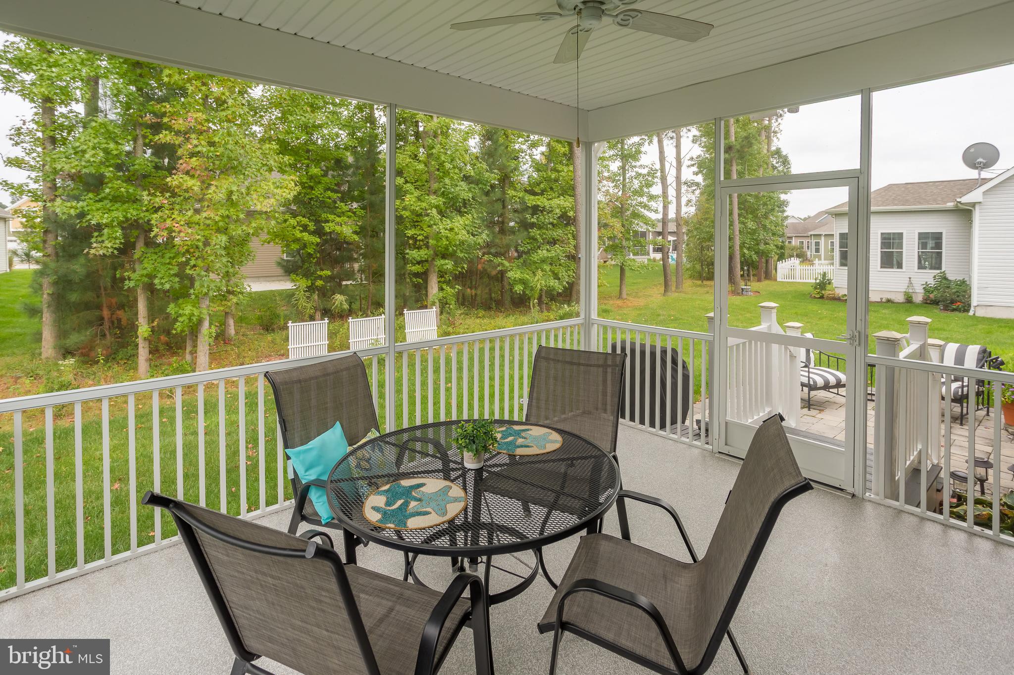 18308 Emerson Way Georgetown, DE 19947 - Photo 21 of 43 a view of a chair and tables in the balcony