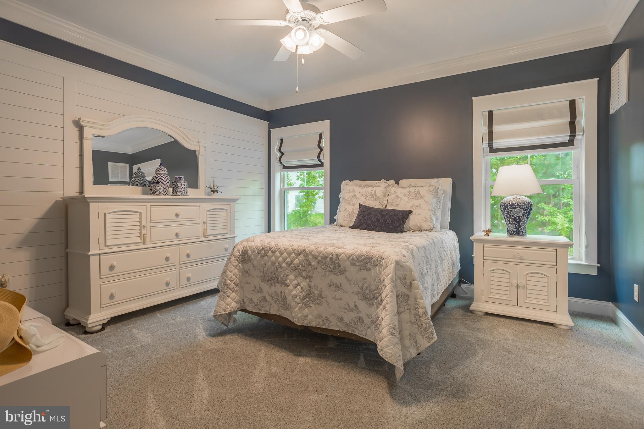 18308 Emerson Way Georgetown, DE 19947 - Photo 24 of 43 a bedroom with a bed and a dresser