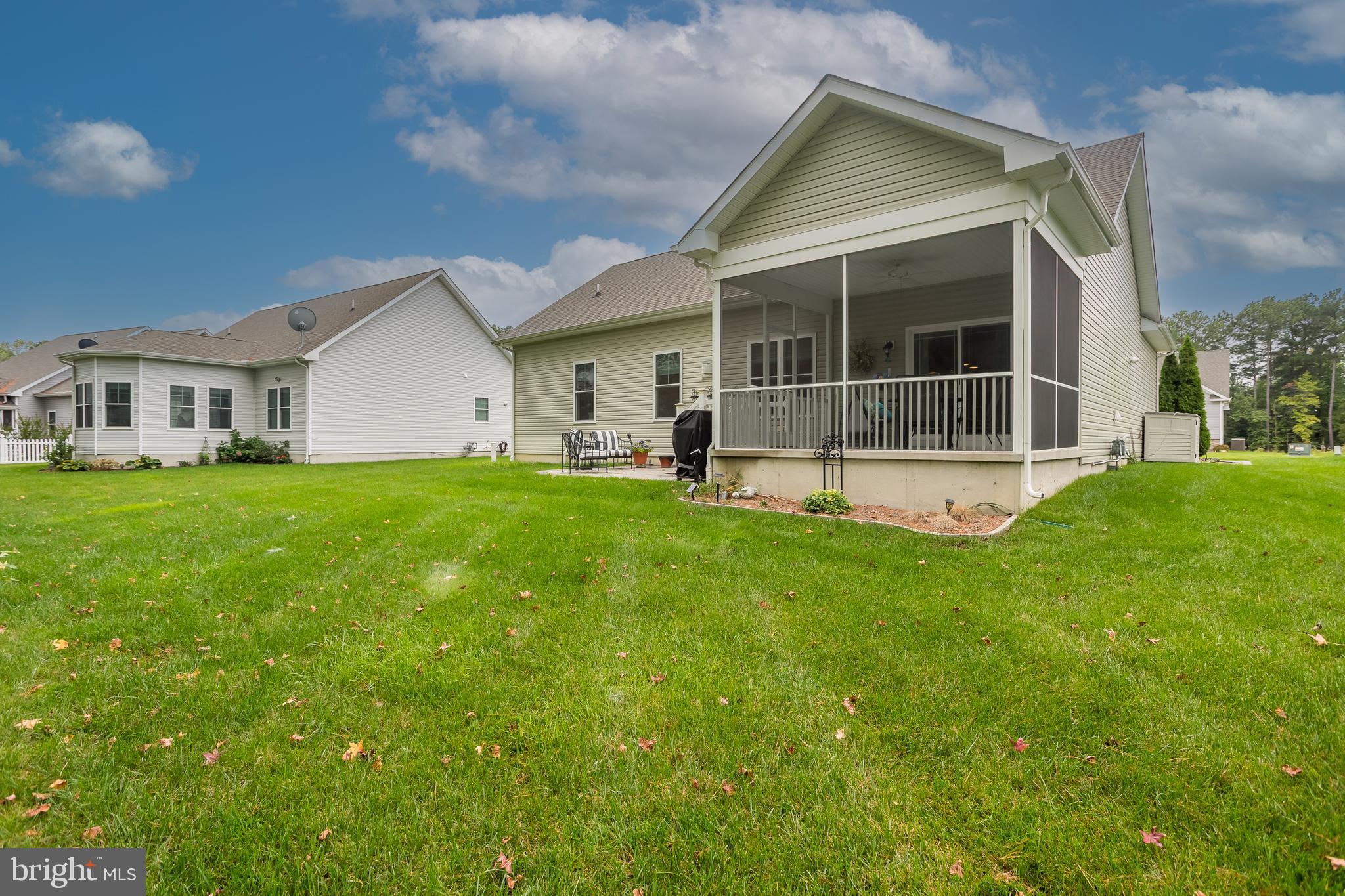 18308 Emerson Way Georgetown, DE 19947 - Photo 35 of 43 a view of a house with a yard and porch
