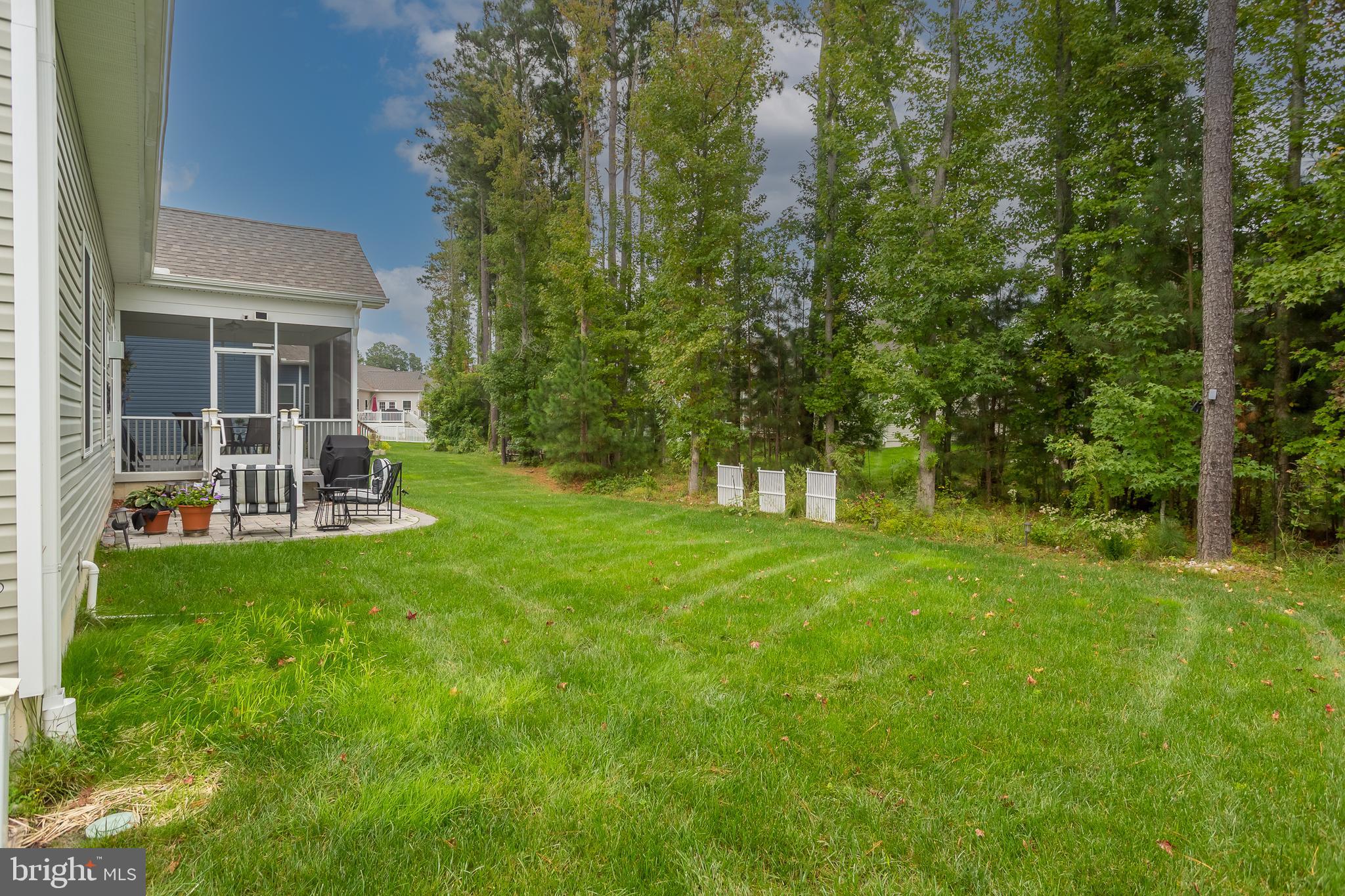 18308 Emerson Way Georgetown, DE 19947 - Photo 36 of 43 a view of a chair and table on the green field