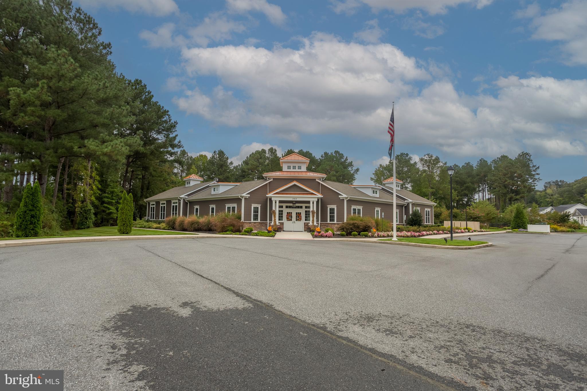 18308 Emerson Way Georgetown, DE 19947 - Photo 37 of 43 front view of a house with a yard